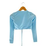 Blusa crop satinada anudada