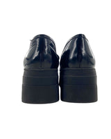 Loafers en cuero con cadena