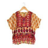 Blusa manga corta con pompones