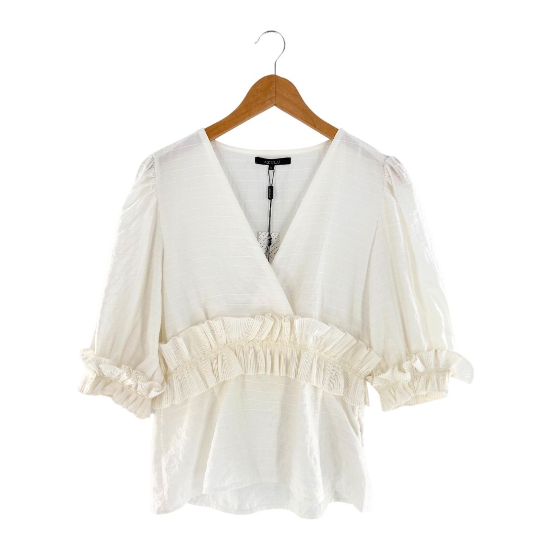 Blusa mangas amplias con vuelo