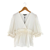 Blusa mangas amplias con vuelo