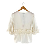 Blusa mangas amplias con vuelo
