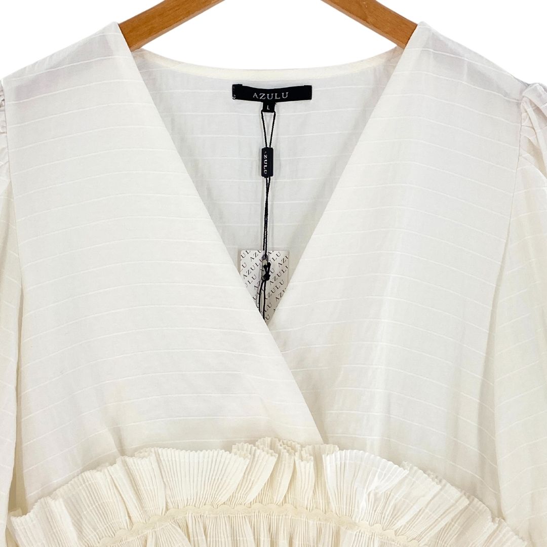 Blusa mangas amplias con vuelo