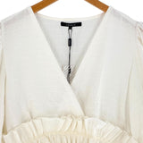 Blusa mangas amplias con vuelo