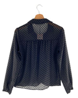 Blusa traslúcida manga larga