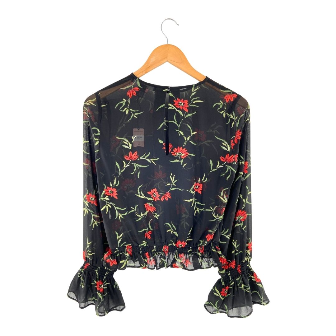 Blusa translúcida encauchada