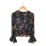 Blusa translúcida encauchada