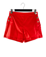 Short mini con botones dorados