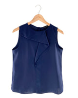 Blusa sleeveless con vuelo