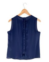 Blusa sleeveless con vuelo