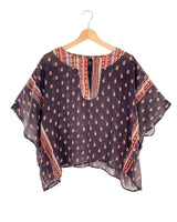 Blusa traslúcida oversize