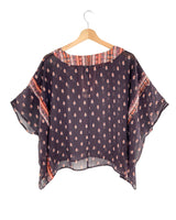 Blusa traslúcida oversize