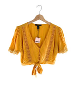 Blusa manga corta con detalles
