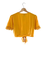 Blusa manga corta con detalles