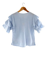 Blusa con vuelos en mangas