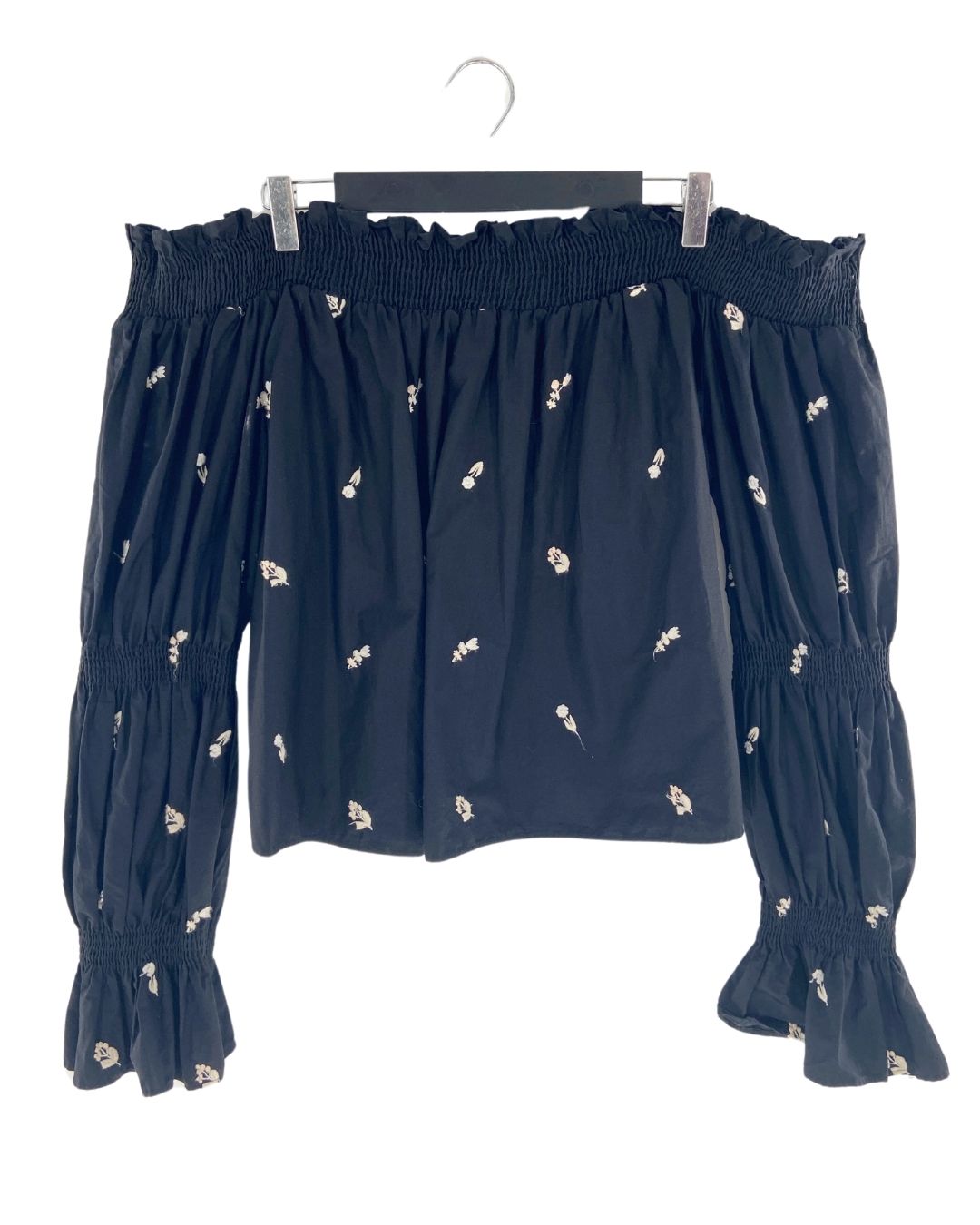 Blusa off shoulder encauchada