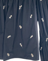 Blusa off shoulder encauchada