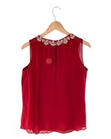Blusa sleeveless con recamado