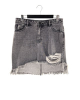 Falda mini en denim destroyed