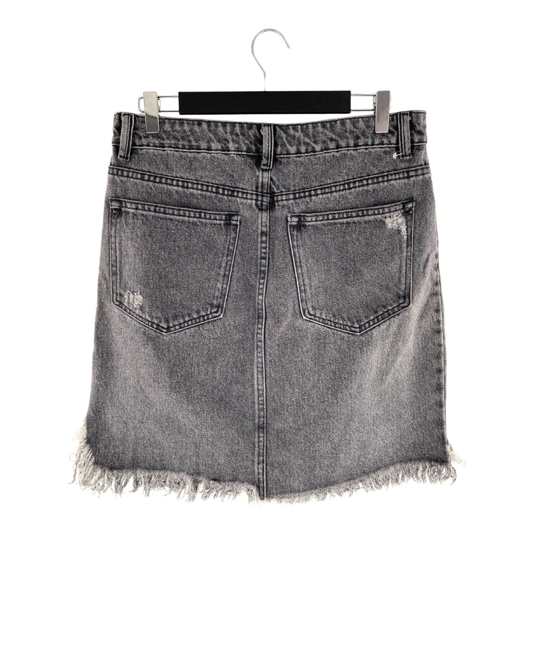 Falda mini en denim destroyed