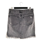 Falda mini en denim destroyed
