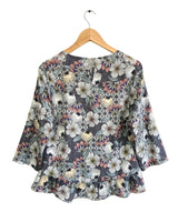 Blusa manga larga con vuelo