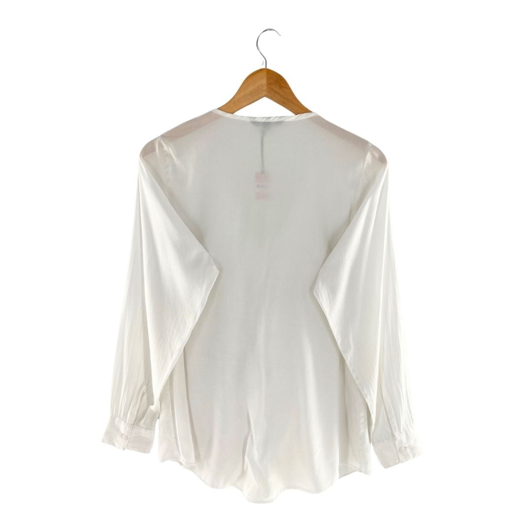 Blusa manga larga con vuelos