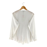 Blusa manga larga con vuelos
