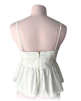 Blusa crop strapless con vuelo