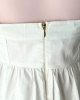 Blusa crop strapless con vuelo