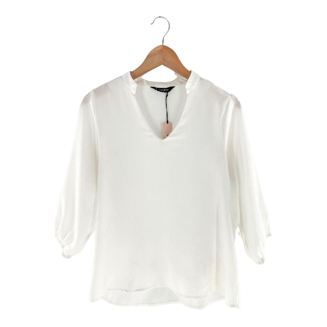 Blusa amplia cuello V