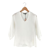 Blusa amplia cuello V