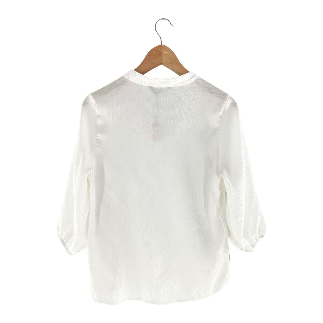 Blusa amplia cuello V