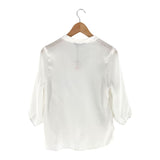 Blusa amplia cuello V