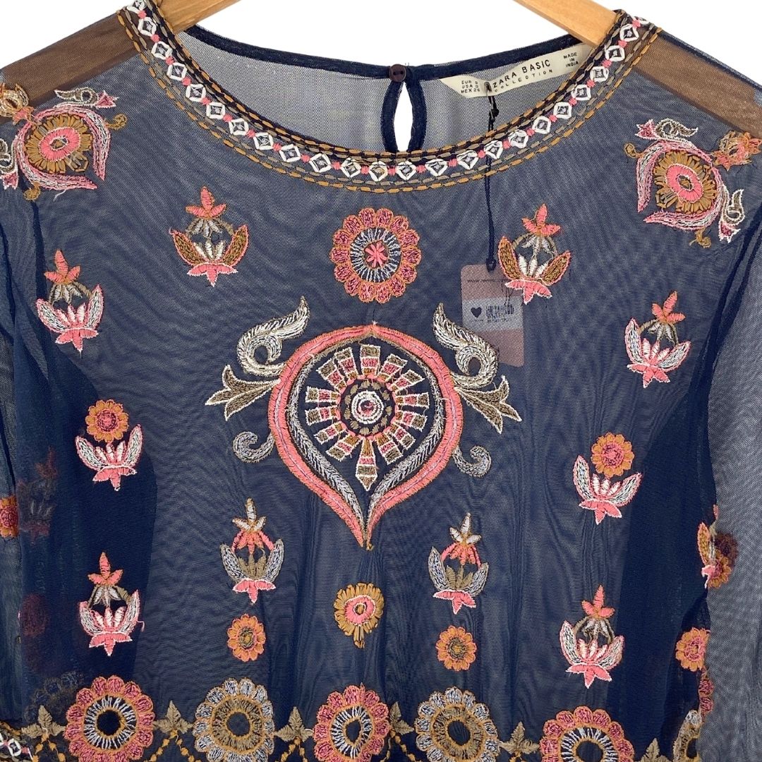 Blusa en malla translúcida