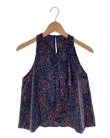 Blusa sleeveless con vuelo