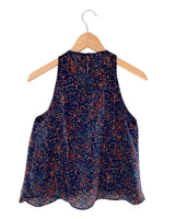 Blusa sleeveless con vuelo