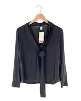 Blusa traslucida anudada