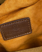 Cartera de mano en cuero