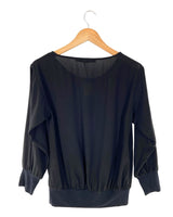 Blusa traslucida manga larga