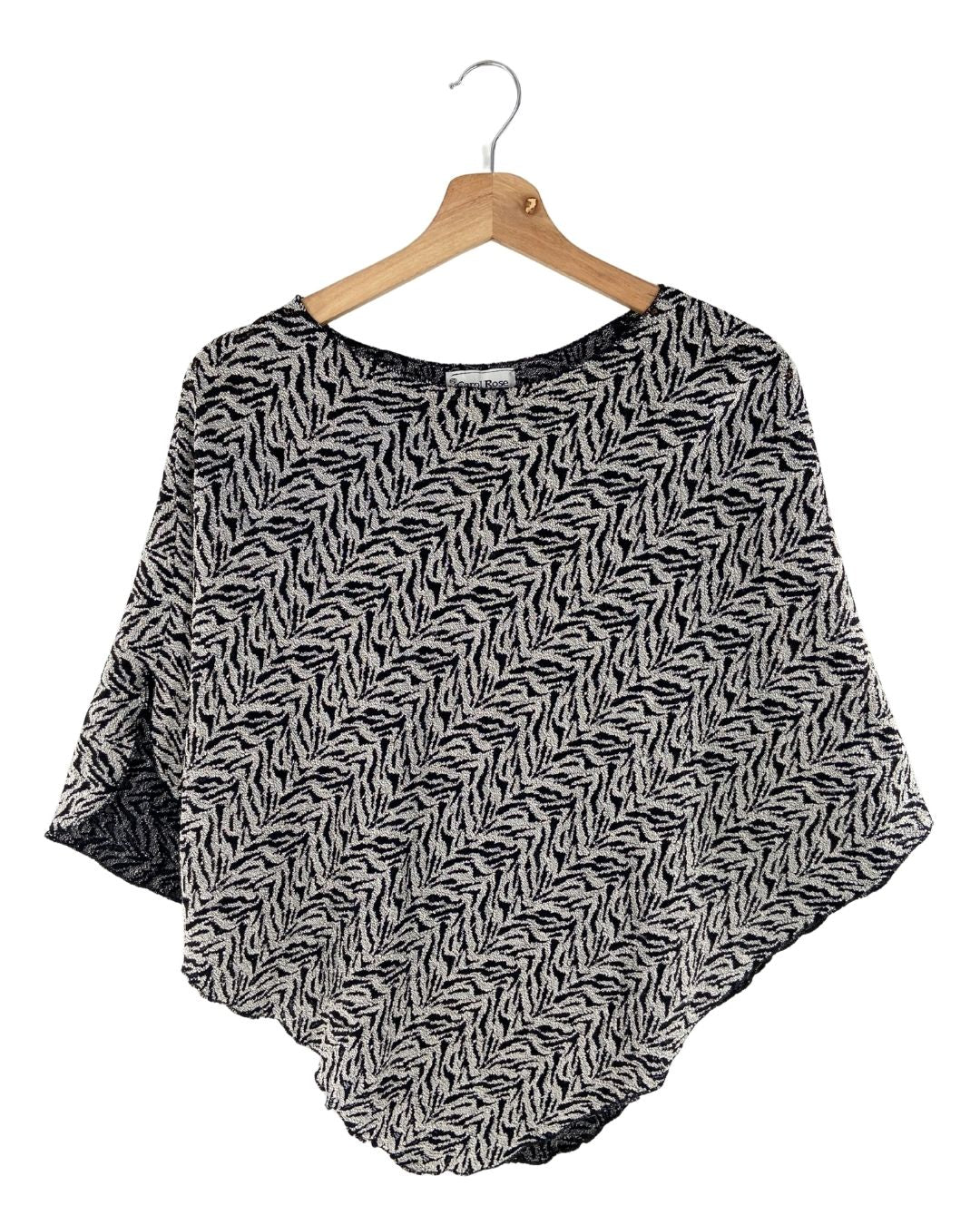 Blusa tejida tipo capa