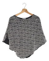 Blusa tejida tipo capa