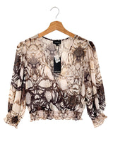 Blusa traslucida encauchada