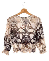 Blusa traslucida encauchada