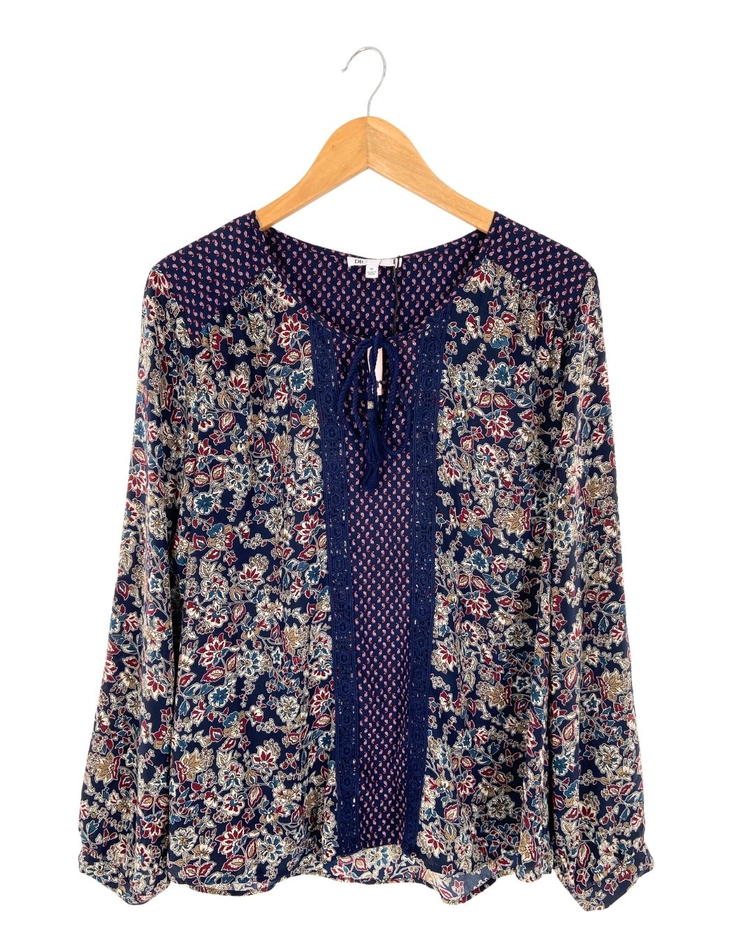Blusa manga larga anudada