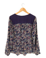 Blusa manga larga anudada