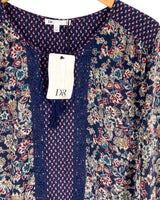 Blusa manga larga anudada