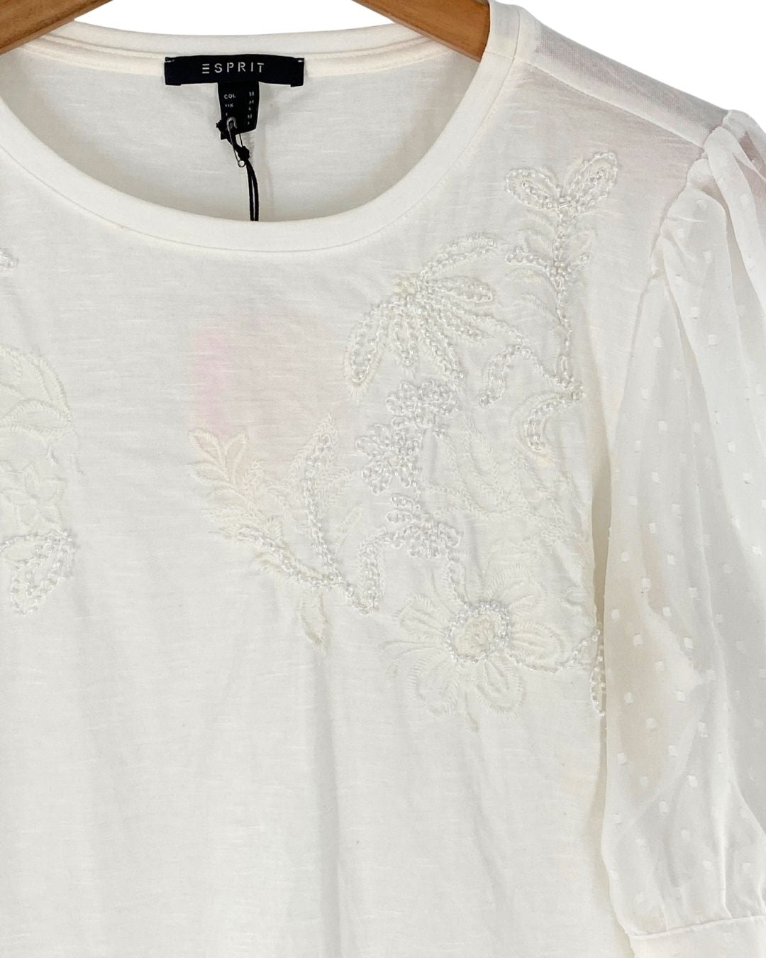 Blusa de mangas traslucidas