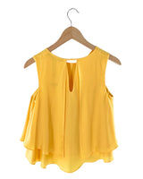 Blusa sleeveless con vuelo