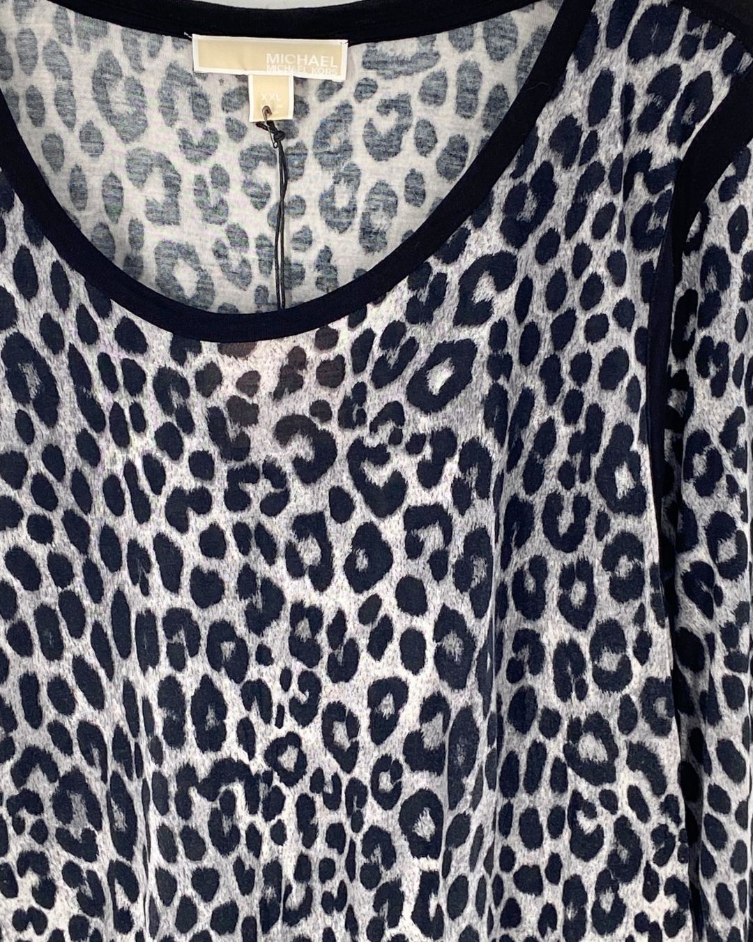 Blusa high and low manga larga